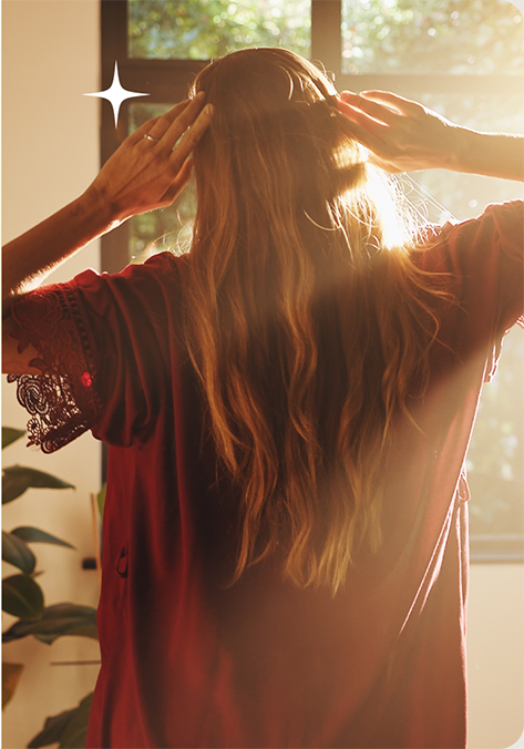 Woman stretching in warm sunlight